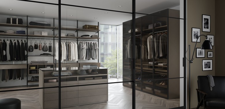 Modern walk-in closet with sliding glass doors
