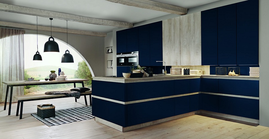 Modern handleless kitchen in dark navy blue and rustic light wood